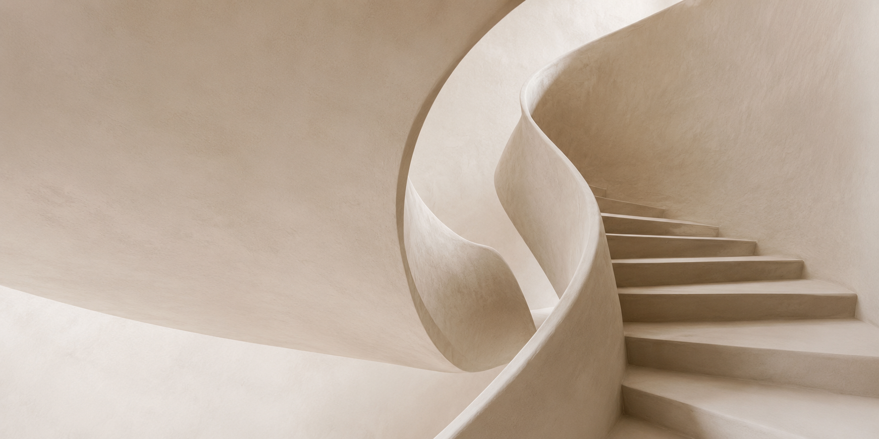 A sculptural plaster staircase curving through soft light