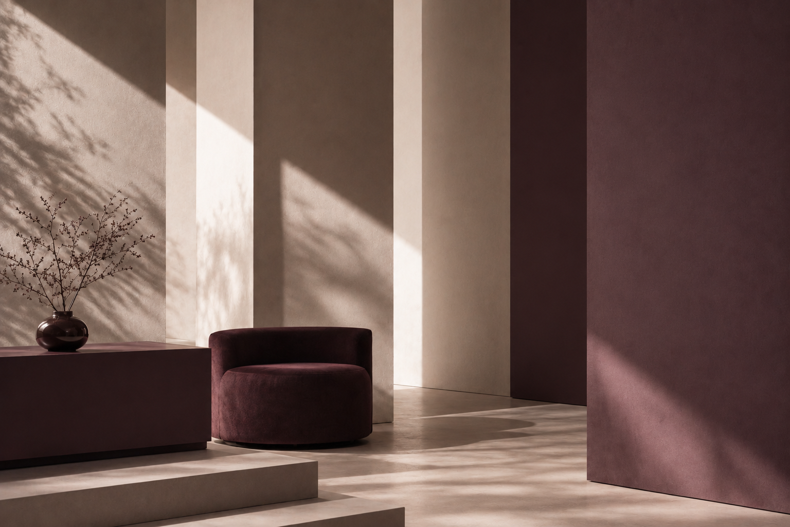 A quiet luxury interior with plum velvet seating, soft light and architectural shadows